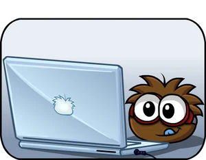 A brown puffle peeking over a laptop